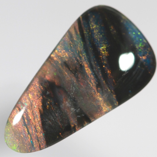 SOLID BLACK OPAL Banded pattern of red and green amongst black bands